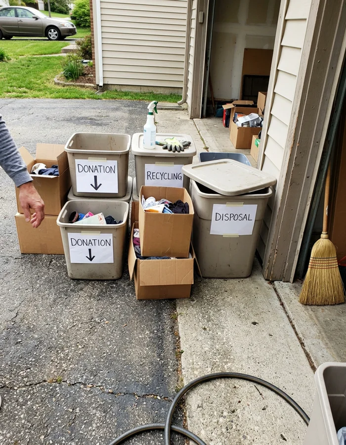 Donation, recycling, and disposal bins sorted during a cleanout